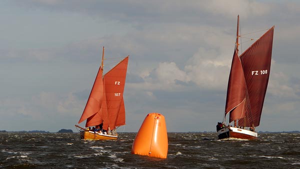 Zeesenboots tacking at a buoy