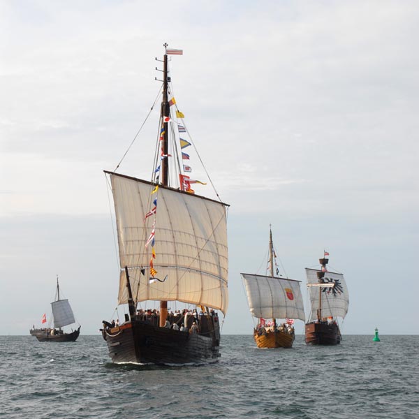 Hanseatic cogs under full sails